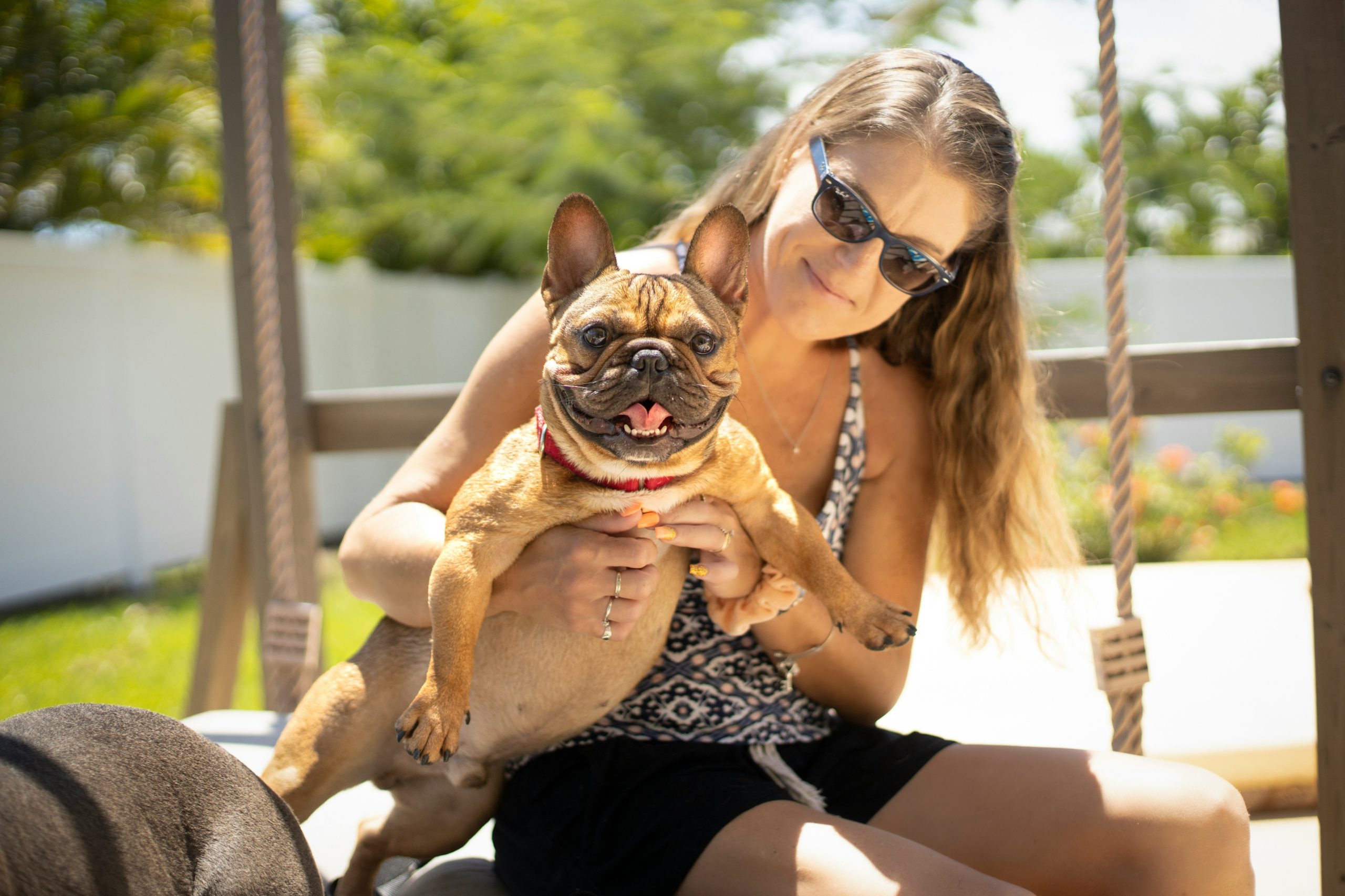 A woman holding her dog